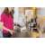 Woman using Kärcher SC 2 EasyFix steam cleaner to clean a stovetop