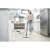 Woman using Kärcher SC 2 EasyFix steam cleaner to clean kitchen floor