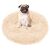 Happy pug sitting in a Springos cream plush dog bed