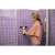Woman using Kärcher WV 5 Plus N window vacuum cleaner to clean a shower door