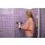 Woman using Kärcher WV 5 Plus N window vacuum cleaner in the bathroom