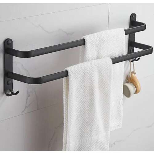Black towel rack with two bars and hooks, mounted on a wall