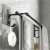 Black aluminum towel rack with two bars and two hooks, 60 cm long, showing the towel rack with towels hanging on it