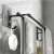 Black aluminum towel rack with two bars and two hooks, 60 cm long, showing the towel rack with towels hanging on it