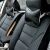 Black eco-leather car headrest pillows installed on car seats