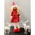Red Christmas fairy figurine with gold wings, standing on a table with two white deer figurines