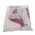 Red and white Santa Claus hat with white pom pom in a plastic bag