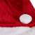 Close-up of the white pom pom on a red and white Santa Claus hat