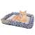 Cat bed with scratching surface, size S, blue and white pattern, cat sleeping on it