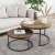 BackHome round dark walnut coffee table set, two nesting tables with black metal frame, used in a living room setting