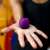 Boompods Zero portable Bluetooth speaker in purple, held in hand