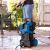 Scheppach HCE 3000 pressure washer in use cleaning patio furniture