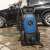 Scheppach HPC 1400 pressure washer in use, cleaning a car