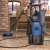 Scheppach HPC 1600 KIT high pressure washer in use, cleaning a patio