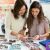 Mother and daughter looking at printed photos using HP ink