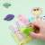 Avenir Crayon Activity Kit 4 Seasons Fun, child's hand coloring a scene with a leaf shaped crayon