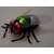 Remote control fly toy with red eyes, green and blue body, and transparent wings