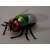 Remote control fly toy with red eyes, green and blue body, and transparent wings
