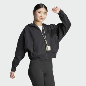 Woman wearing a black Adidas Z.N.E. hoodie, full zip, showcasing the fit and style. - Adidas Women's Sweater