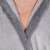 Close-up of the collar on a gray hooded bathrobe for men
