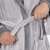 Close-up of the belt on a gray hooded bathrobe for men
