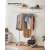 Songmics by Zielhome garment rack with clothes and accessories hanging on it