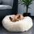 French bulldog sleeping in a Springos 90cm cream donut dog bed