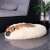 French bulldog sleeping in a Springos 90cm cream donut dog bed