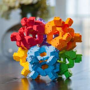 Fat Brain Toys Reptangles Turtles That Snap building toy, colorful plastic pieces assembled into a geometric shape - Wooden building game