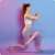 Woman using a pink resistance band for a lunge workout