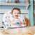 Ricokids Eldo high chair in use, baby sitting and eating