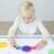 Child playing with Miniland Translucent Color Palettes, color mixing and learning game for preschoolers