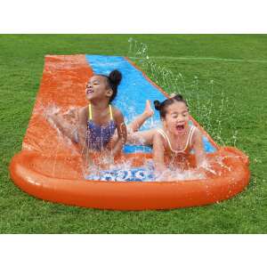 Two children sliding down a Bestway H2GO water slide in the backyard - Bestway