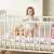 Ricokids 3m braided crib bumper in pink, white and grey, used in a crib