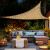 Home MXNV3 LED shade sail illuminating a patio at night