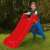 Child playing on Dolu My First Slide red plastic slide for kids with blue ladder