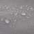 Close-up of gray sun sail fabric with water droplets on it