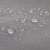 Close-up of gray sun sail fabric with water droplets on it