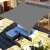 Gray rectangular sun sail, 3x2m, installed on a patio with furniture