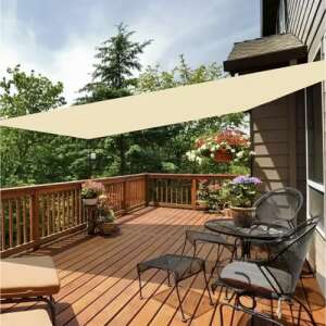 Beige sun shade sail installed on patio - Awning & Shade