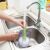 Faucet brush extender cleaning a pitcher, kitchen cleaning