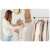 Woman using the garment rack to organize her clothes