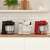 Bosch MUMS2EB01 kitchen machines in black, white, and red on kitchen counter