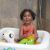 Toddler in Bestway inflatable baby tub with bath toys, square baby tub