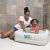 Mother bathing baby in Bestway inflatable square tub, white baby tub