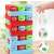 Jenga Stackers game being played by a child, stacking blocks and rolling a dice