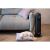 Adler AD7731 ceramic tower heater in living room setting with dog
