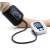 Person using Arm Style digital blood pressure monitor on their arm, ZK-B869YB