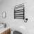 Black electric towel warmer with shelf, Sioyie brand, in a bathroom setting