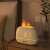 RetroFlame Flame Effect Aroma Diffuser 250ml - White on a nightstand